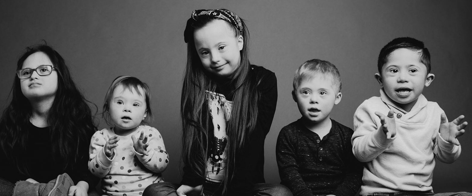 Five children with Down syndrome sitting together